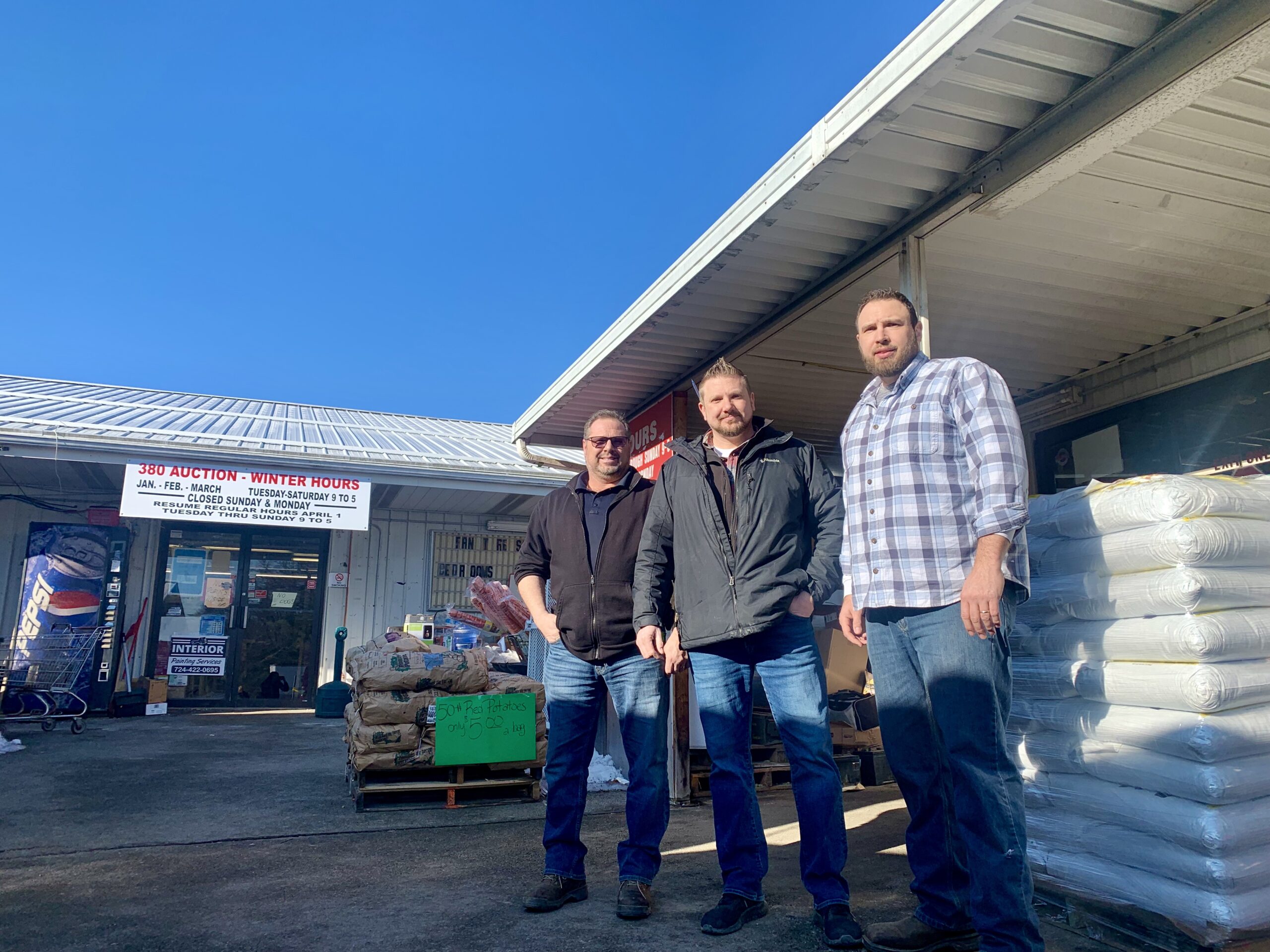 (Left to Right) Dave Beacom, Jim III Beacom, and Matt Beacom stand outside of 380 Market Discount Warehouse where they have worked amoung close family for years. (Shannon M. Venditti).jpeg